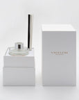 A close-up of the opened white Vaucluse gift box revealing the tailored interior compartments designed to securely hold the clear glass diffuser bottle and reed assembly.