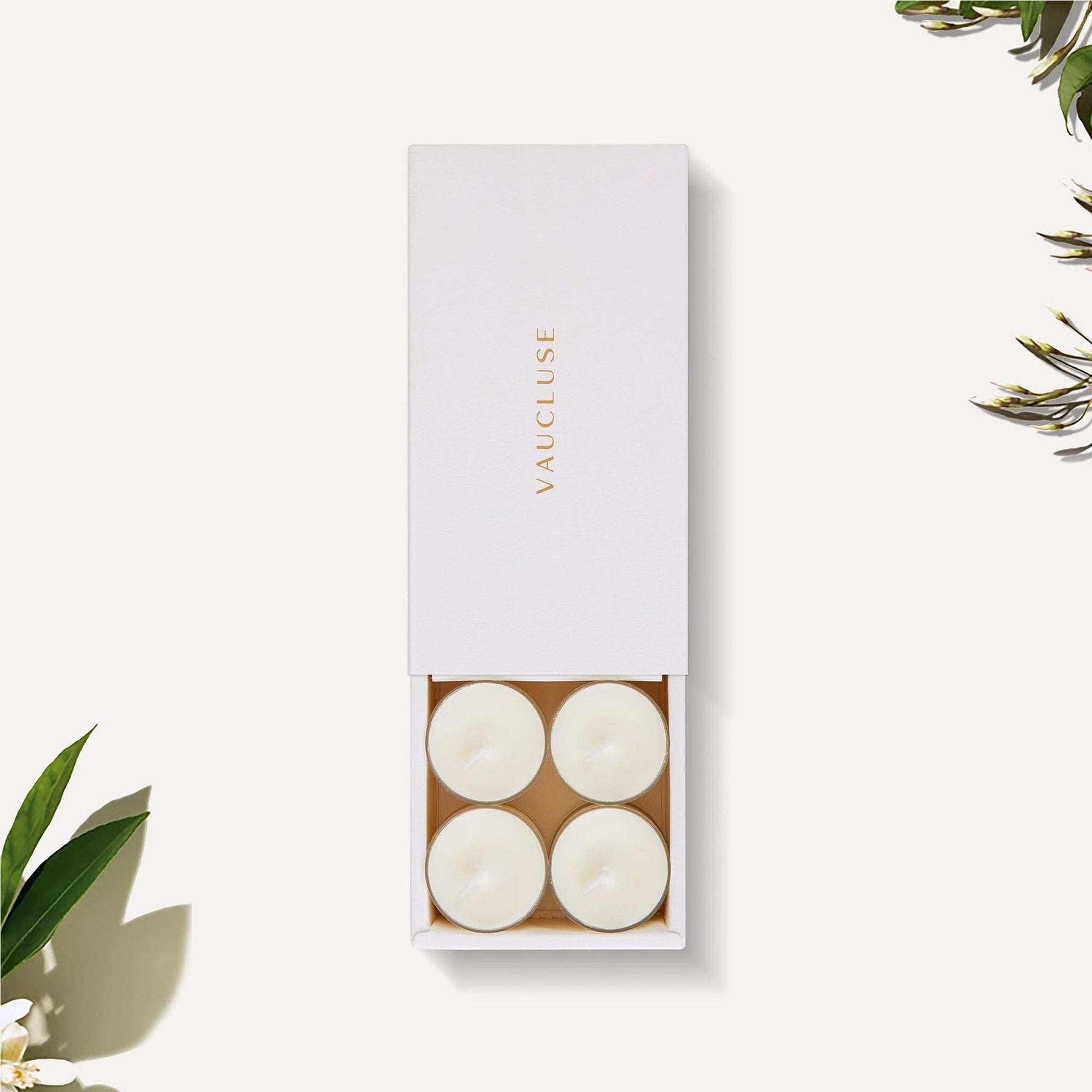 Vaucluse jasmine scented white tealight candles arranged in a luxury sliding white gift box with gold logo detailing