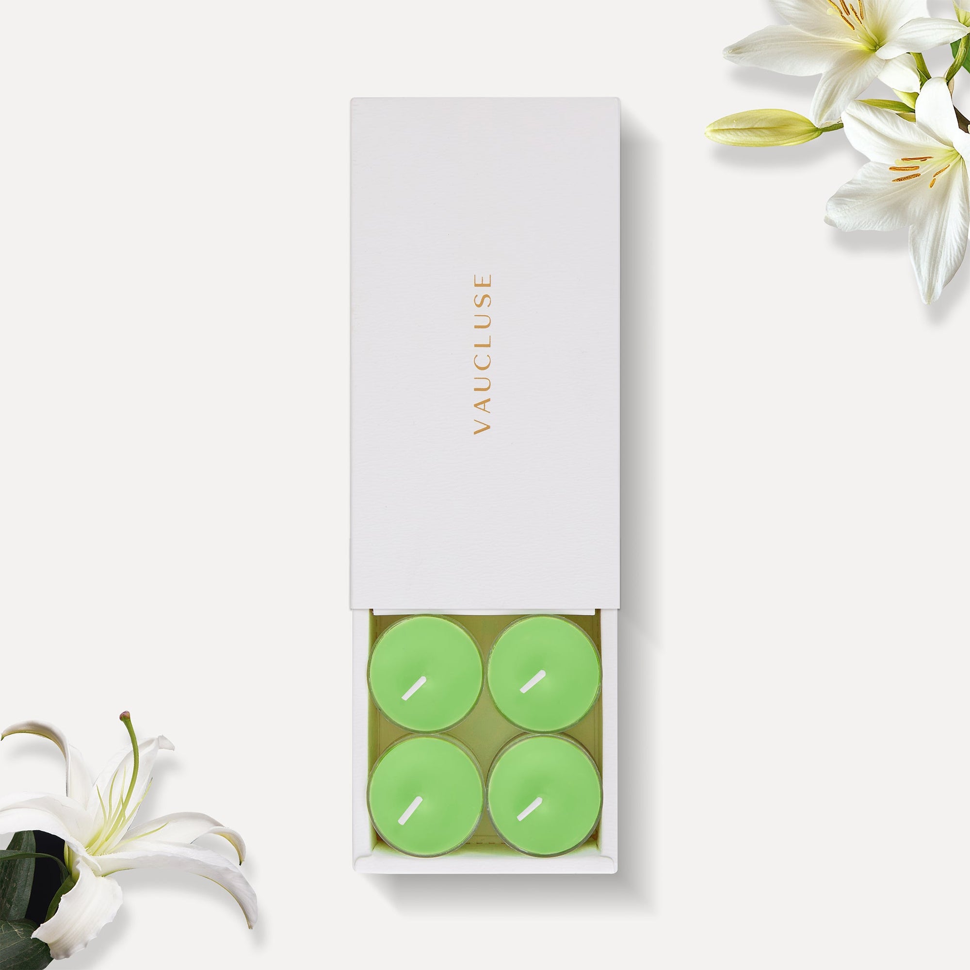Vaucluse Lily scented tealight candles in minimalist luxury packaging.