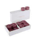 An open luxury white Vaucluse box set displaying premium deep purple blackberry scented tealight candles arranged in a tiered 16-pack tray.