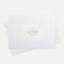 Overhead view of a minimalist luxury white romantic greeting card featuring gold foil text reading With Love Always, displayed with its matching envelope.