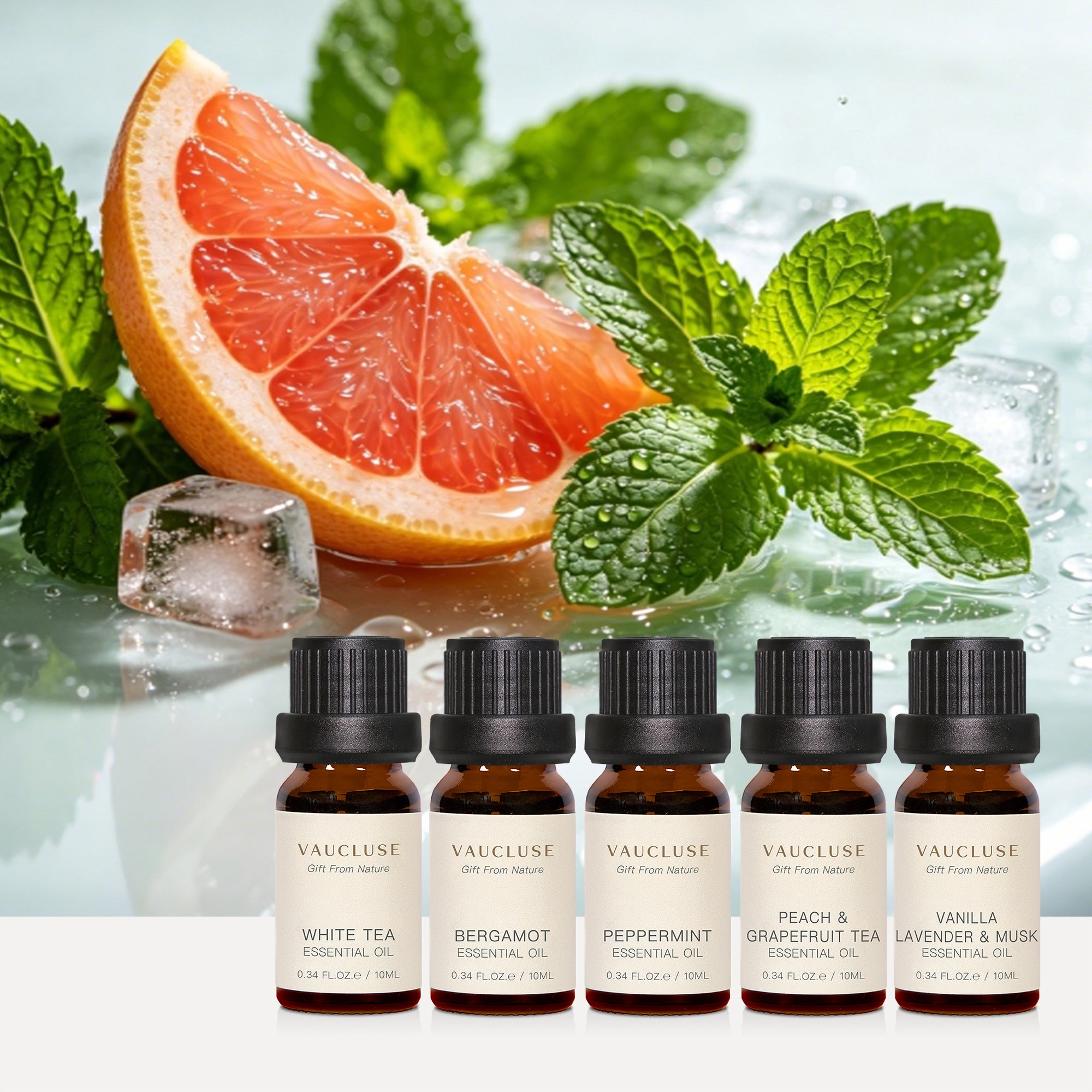Vaucluse Fresh & Clean Collection essential oils featuring White Tea and Bergamot, displayed with refreshing grapefruit slices, mint leaves, and ice.