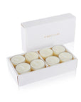 An open luxury white Vaucluse box set displaying premium cream white musk scented tealight candles arranged in a tiered 16-pack tray.