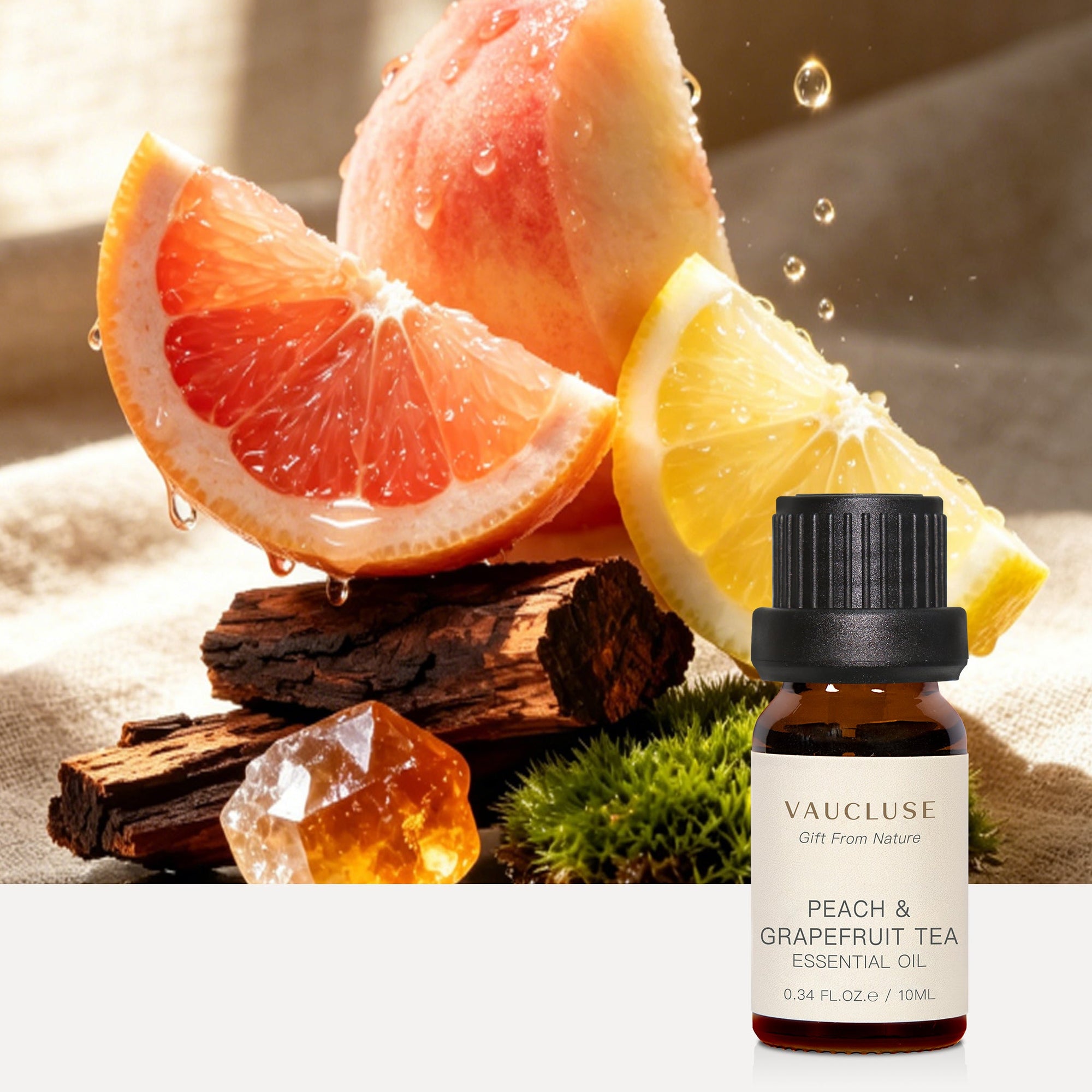 Vaucluse Peach and Grapefruit Tea essential oil bottle alongside fresh peach, citrus fruits, and natural amber resin.
